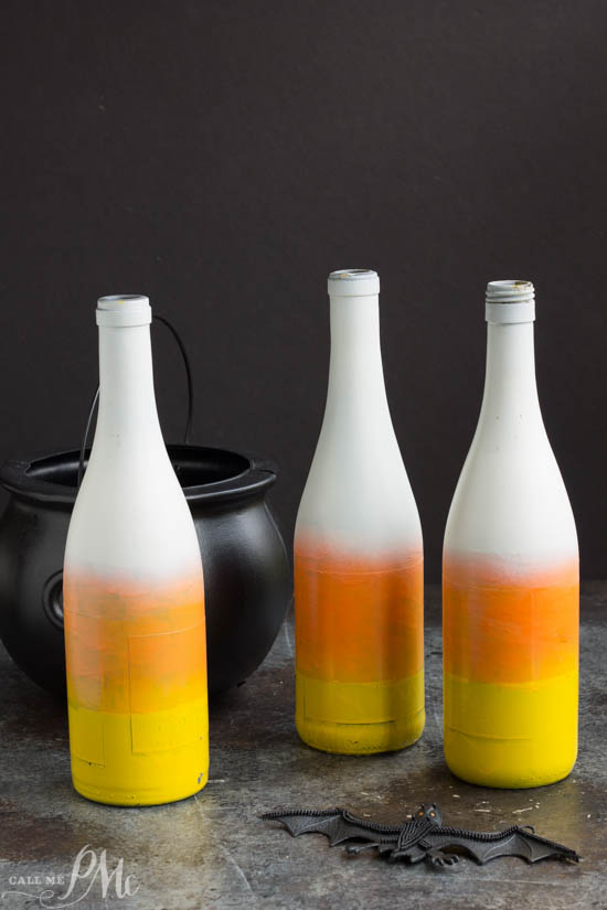 Candy Corn painted bottles for fall table or yard decoration. 