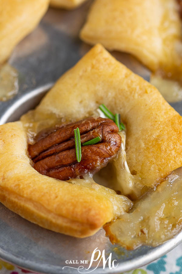Hot Honey Brie Pecan Bites, buttery crescent roll dough is filled with brie, pecans, and drizzled with spicy honey. These make a wonderful slightly sweet appetizer. #pecan #brie #crescentrolls #appetizer #party Hot Honey Brie Pecan Bites
