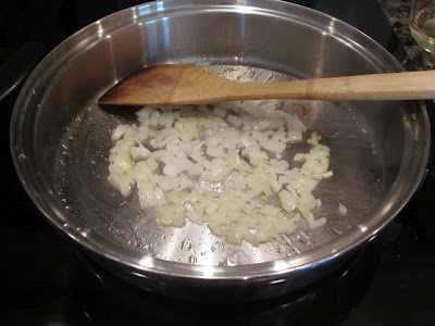 cooking diced onions in a saucepan.