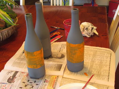painting bottles for a fall decorating idea.