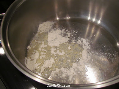 Roux in a stainless steel pot on stove.