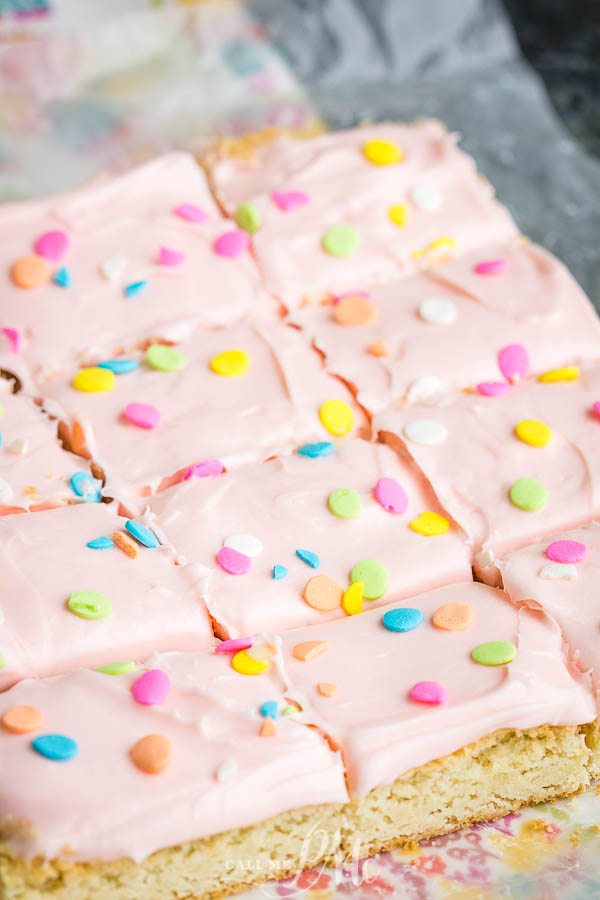 Frosted Sugar Cookie Bars have a super soft cookie base with a luxuriously thick and creamy buttercream frosting on top! #recipe #easy #sheetpan #frosted #Lofthouse #creamcheese #Easter #Christmas Frosted Sugar Cookie Bars