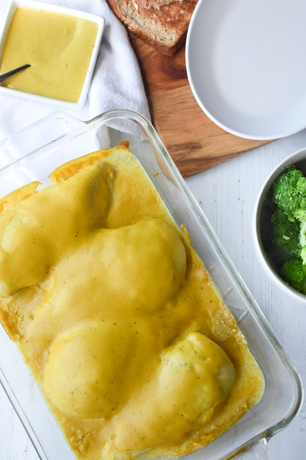 Tangy Ranch Chicken is easy to make, creamy, and spicy baked chicken recipe with only four ingredients, ranch dressing, yellow mustard, and brown sugar.ย #bakedchicken #chicken #recipe #mustard #ranch #sauce #easy Glass casserole full of cheese and protein.