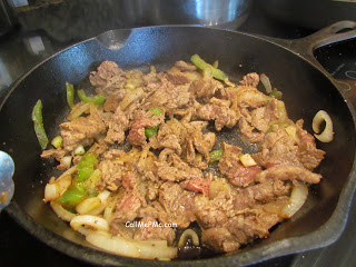 steak and peppers in pan