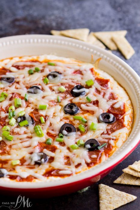 A delicious creamy cheesy pizza dip loaded with sauce & your favorite toppings, hot from the oven!