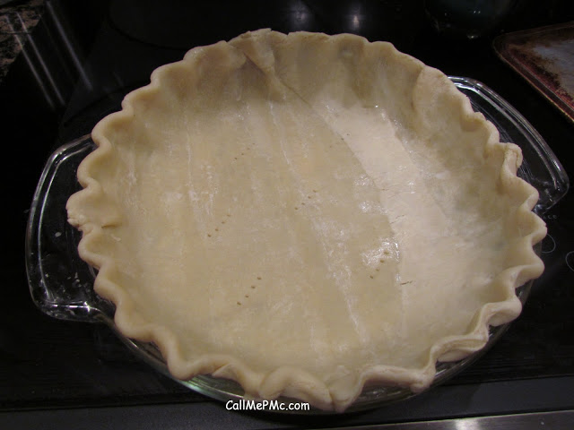 Unbaked pastry crust in baking dish.