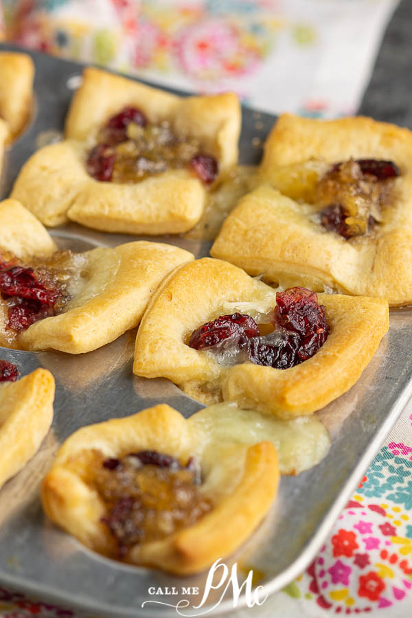 appetizer bites in mini muffin tin pastry cups filled with dried cranberries.