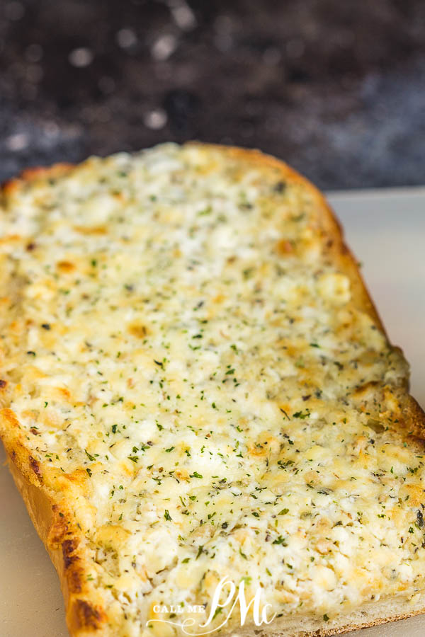 Easy Cheesy Garlic Bread is a delicious, easy, cheesy bread recipe that goes with any casserole, soup, or pasta! It's garlicky and flavorful with crispy edges and a soft, cheesy buttery center. #garlicbread #garlic #bread #sidedish #recipe #callmepmc Easy Cheesy Garlic Bread