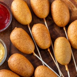 baby corn dogs on skewers.