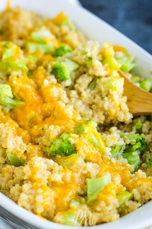 Cheesy broccoli quinoa casserole in a white serving dish.