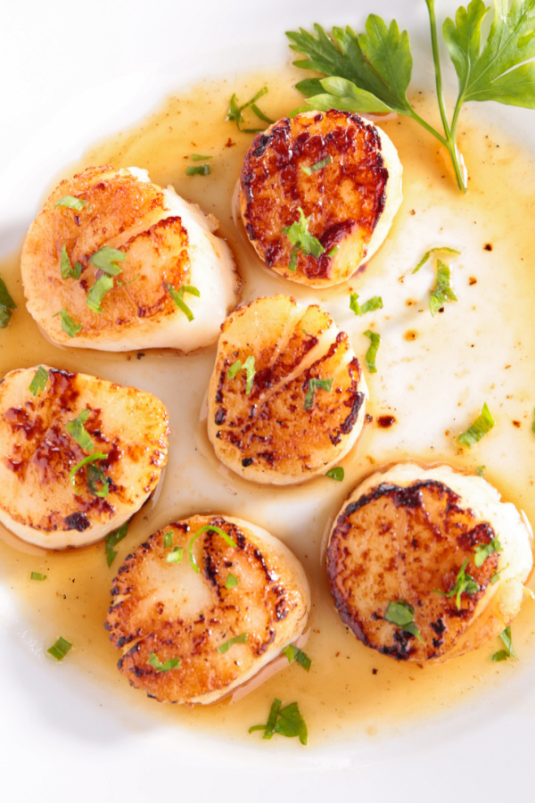 Seared Scallops are paired with an easy-to-make butter sauce, this is a restaurant-quality scallop dinner for a portion of the price! SEARED SCALLOPS