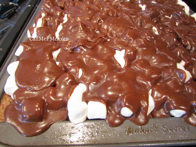 chocolate frosting over marshmallows and cake chocolate cake with marshmallows and icing