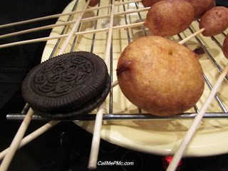 deep fried Oreo cookie on a skewer.