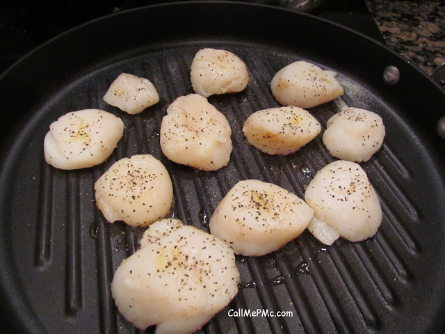 large scallops in a pan large scallops in a pan