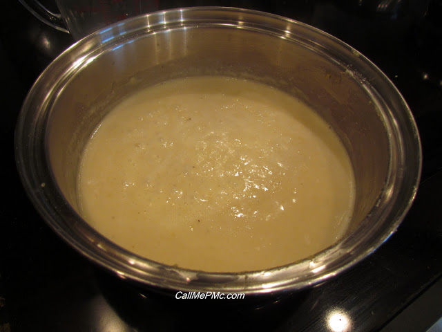 Bechamel sauce cooking in a saucepan for a broccoli quinoa casserole recipe.