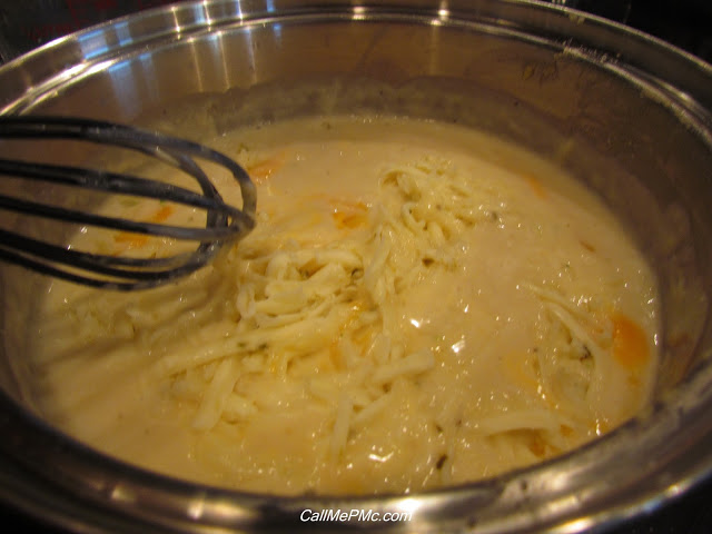 whisking cheese into a white sauce for quinoa casserole.