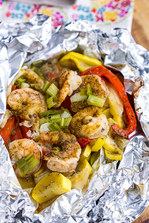 Delicious, healthy, and done in 30 minutes Shrimp Foil Packs in Oven are cooked in foil packets for a fuss-free weeknight meal and easy cleanup! #shrimp #foilpack #camping #campfire #grill #bake #oven #30minutemeal