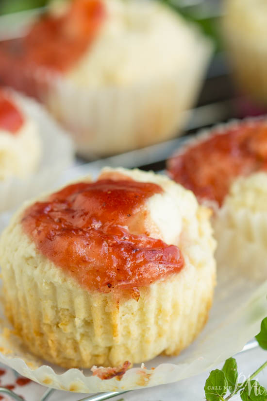 Muffins with strawberry jam on top.