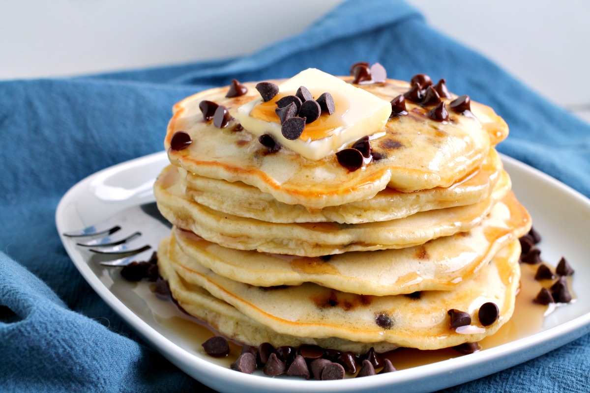 Light, fluffy, and super easy homemade Chocolate chip Pancakes are the most delicious breakfast treat. #pancakes #breakfast #recipe #homemade #fromscratch #chocolatechip Chocolate chip Pancakes
