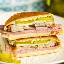 This crispy, gooey Zesty Cuban Sandwich is filled with melty cheese, tangy mustard, smoked pork tenderloin, honey ham, and crunchy pickles.