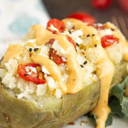 Twice Baked Feta Tomato Potatoes make a delicious main or side dish and compliment any main entree. They're cheesy and full of flavor. #stuffedpotatoes #twicebakedpotatoes #recipe #sidedish #collegestudentrecipes #callmepmc