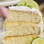 Lime & Coconut Icebox Cake with Fresh Whipped Cream recipe combines the ever popular Icebox Pie with a layer cake. This dessert is cool and refreshing. Spiked with tropical flavors of citrus and coconut this makes a tasty hot weather dessert.