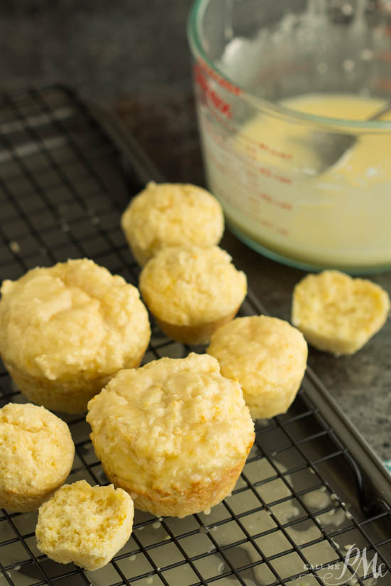 recipe. Brighten your day with these little bits of sunshine! Orange Muffins are topped with a sweet citrus glaze and make a tasty on-the-go breakfast. Large and small muffins cooling on a wire rack.