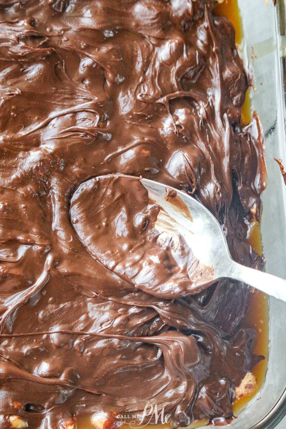 spreading melted chocolate over top of dessert bars.