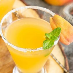 Peach Bellini Martini with vodka, peach schnapps, and peach nectar makes the perfect refreshing cocktail for a warm afternoon or a fancy brunch.