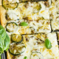 Fresh Zucchini Tart starts with an easy premade crust, topped with zucchini then smothered with cheese.