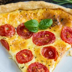 Tomato Cheese Tart has a buttery, flaky, and tender crust filled with creamy cheese and topped with sun-ripened tomatoes.