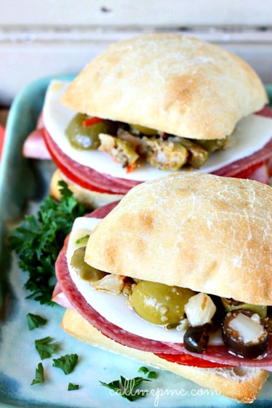 This New Orleans classic,ย Central Grocery Mini Muffuletta Sandwich,ย is full of meats, pickled vegetables, and olive salad. It's easy to assemble and easy to polish off. Muffuletta Sandwich