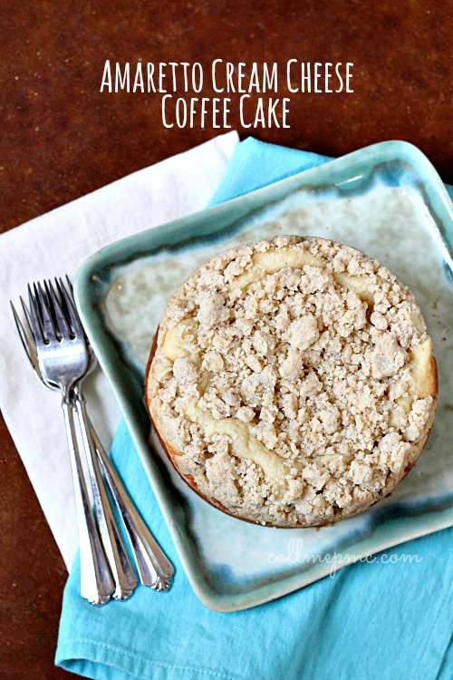 Amaretto Cream Cheese Coffee Cake Recipe is a sweet, dense coffee cake topped with extra crumb topping and filled with a ribbon of cream cheese. #coffeecake #cake #dessert #creamcheese #streusel #baking