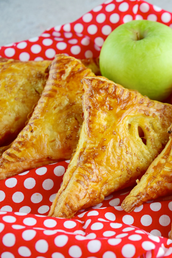 Easy Apple Turnovers are light, flaky & filled with apple cinnamon goodness!