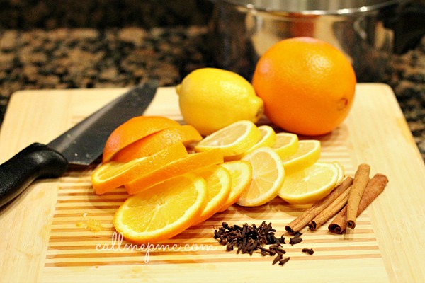 Fruit cut on cutting board with knife.