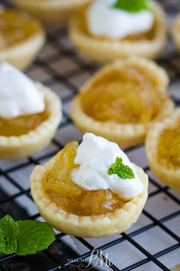 15-Minute Mini Apple Pies make a deliciously easy dessert. These bite-size pies are perfect for the holidays and entertaining! #apples #applepie #pie #dessert #recipe #homemade #easy Small dessert on cooling rack.