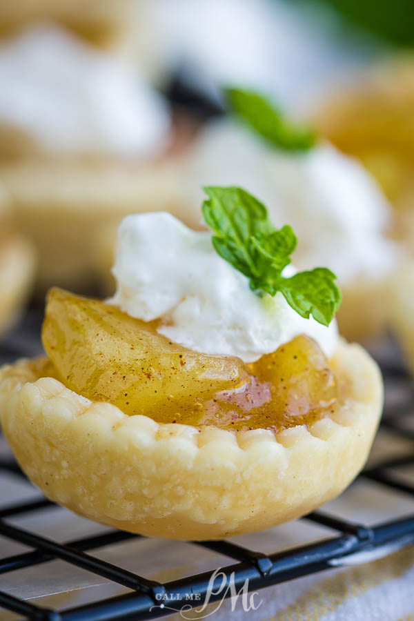 15-Minute Mini Apple Pies make a deliciously easy dessert. These bite-size pies are perfect for the holidays and entertaining! #apples #applepie #pie #dessert #recipe #homemade #easy Small dessert on cooling rack.