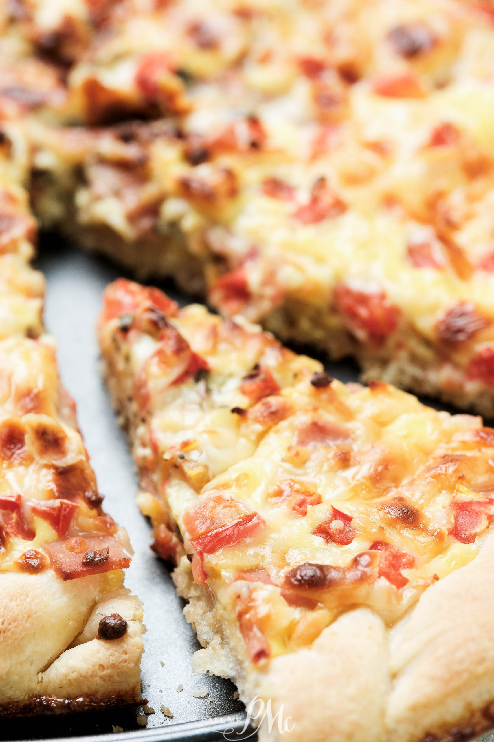 breakfast pizza slice of Cheddar Ham Breakfast Pizza