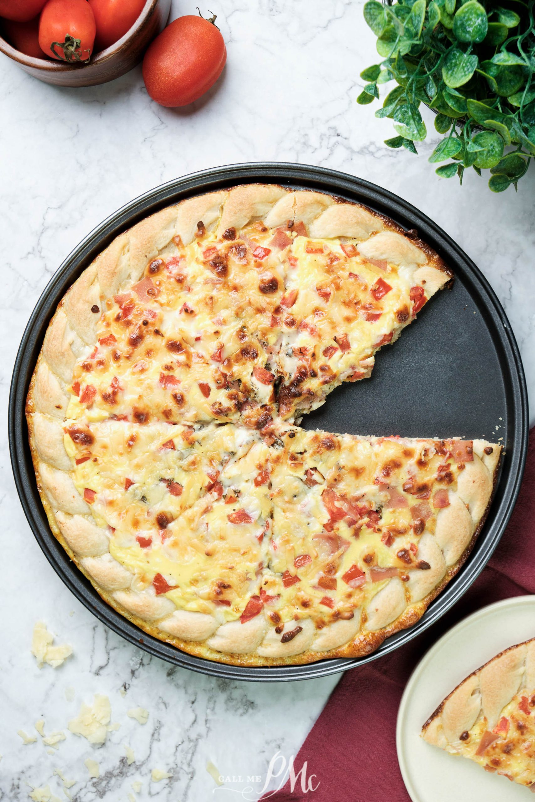 This Cheddar Ham Breakfast Pizza recipe has eggs, cheese, and ham baked into a thick, chewy, store-bought crust! It checks all the boxes for speed, budget, and flavor.