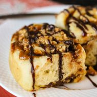 Snickers Bars Cinnamon Rolls, pillowy soft dough is full of buttery caramel, rich chocolate, and crunchy peanuts. These gourmet sweet rolls are pure decadence!