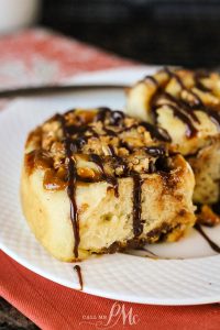 Chocolate caramel cinnamon roll on a plate.