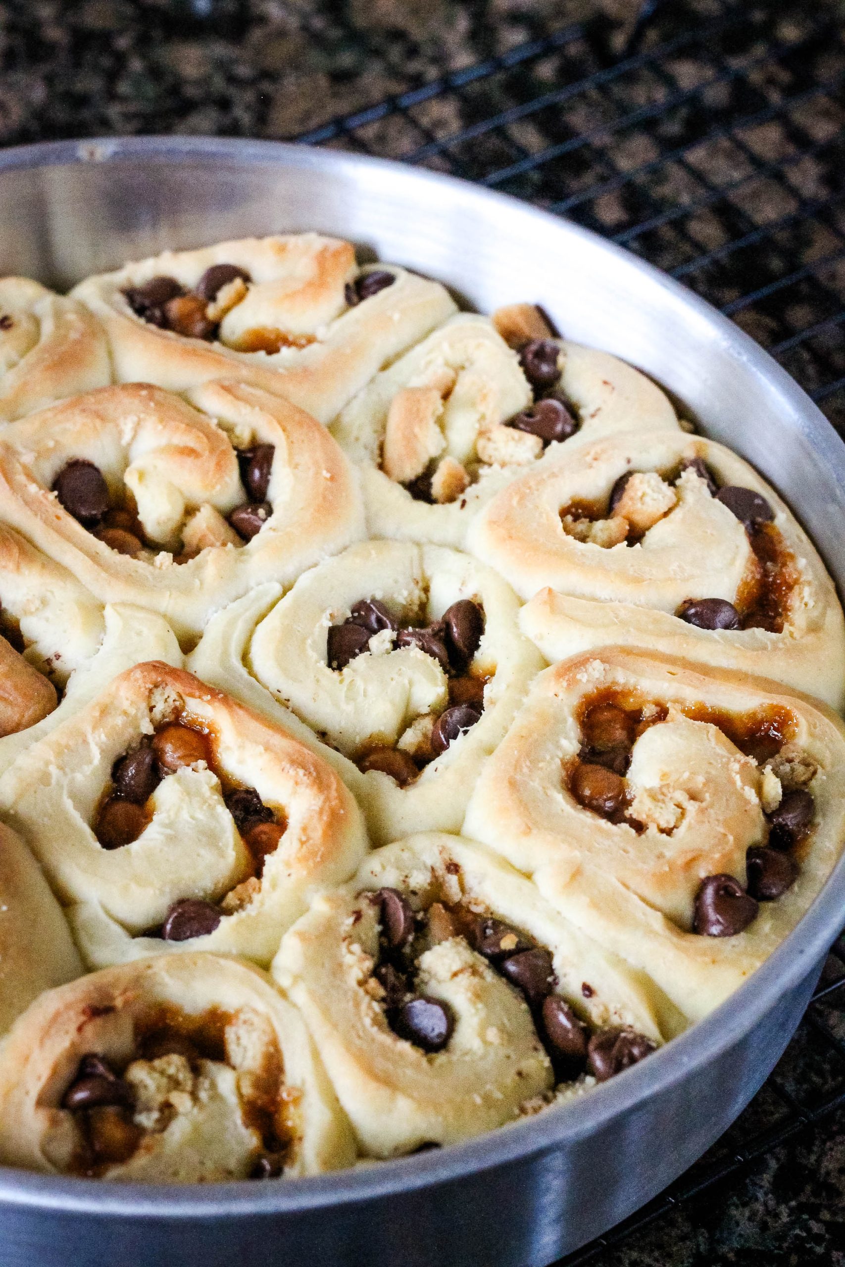 A pan of bread on a cooling rack.