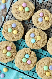 Eight Cereal Crunch Cookies with colorful candy pieces rest on a cooling rack, waiting to delight your taste buds.