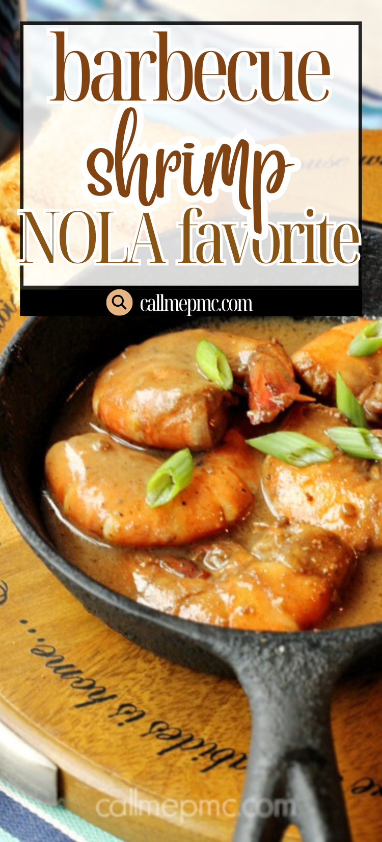 A cast iron skillet filled with juicy Barbecue Shrimp in sauce, garnished with green onions, sits on a wooden surface with a slice of bread in the background.