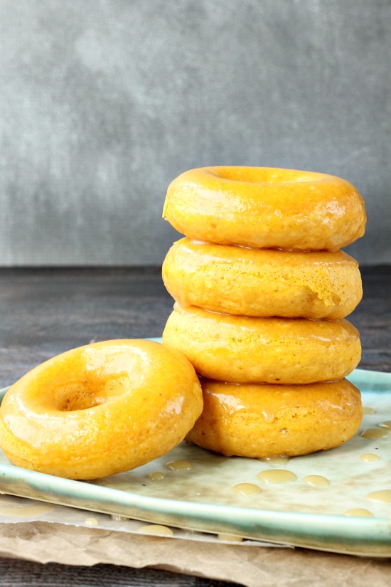 These doughnuts won't blow your diet because they're baked! Baked Pumpkin Donuts with Caramel Glaze