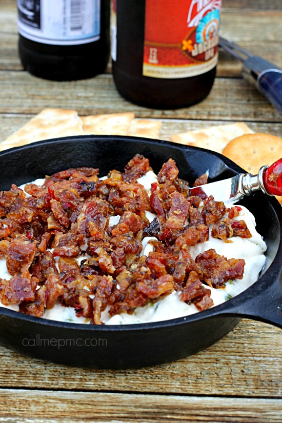 Creamy corn and bacon dip in cast iron skillet.