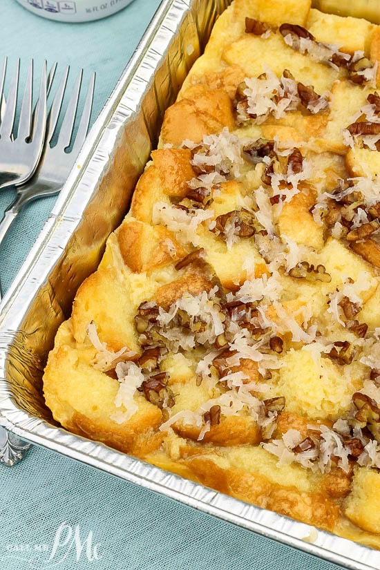 pan of baked bread pudding with coconut flakes.