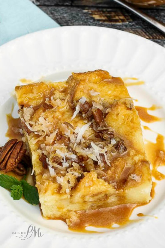 Serving of caramel bread pudding on a white plate.
