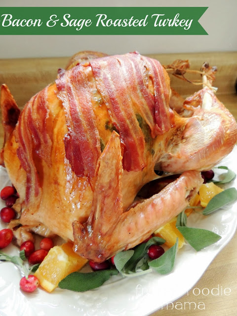 Whole bird wrapped in bacon and decorated for the holiday.