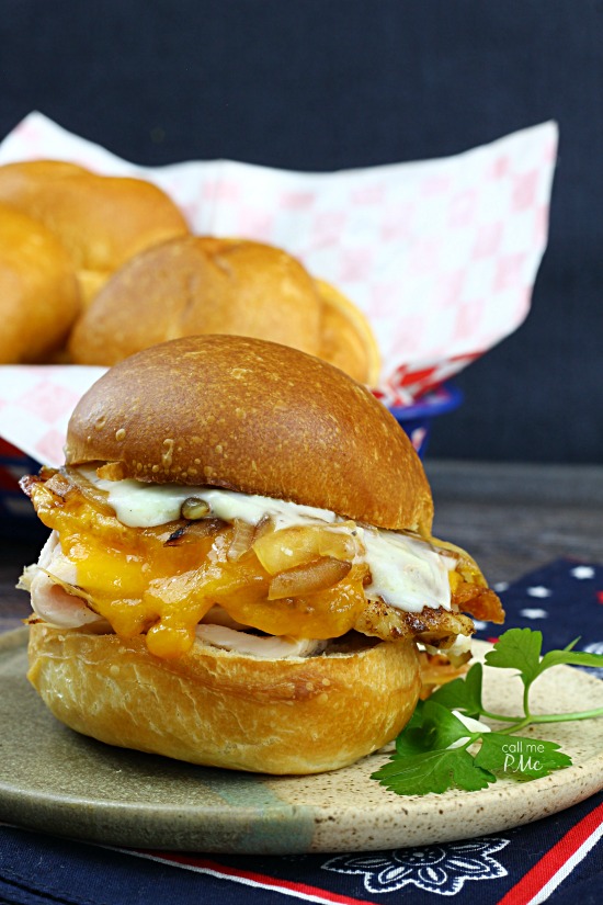 Kentucky Hot Brown Sliders Recipeย the traditional open-face sandwich is turned into a hand-held treat perfect for game day. It isย indescribably delicious with various flavors and texture. #ham #turkey #cheddar #sliders #sandwiches #Kentuckyhotbrown #tailgating #recipes Kentucky Hot Brown Sliders Recipe from callmepmc.com is a hand-held take on the classic reicpe
